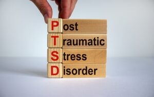 Post traumatic stress disorder (PTSD) spelled out using blocks