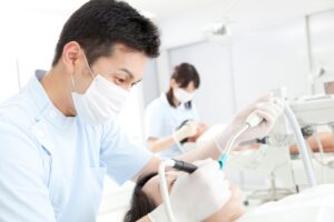 DENTAL PROFESSIONALS TREATING THEIR PATIENTS