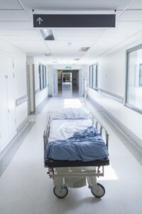 EMPTY HOSPITAL GURNEY IN CORRIDOR
