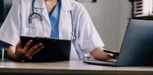 GP reading medical documents after negligently misdiagnosing patient