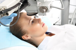 A female patient having laser eye surgery.