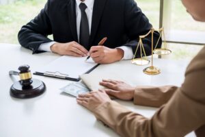 Solicitor explaining after the event insurance to their client.