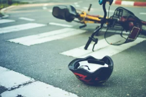 Bike and helmet on road floor.